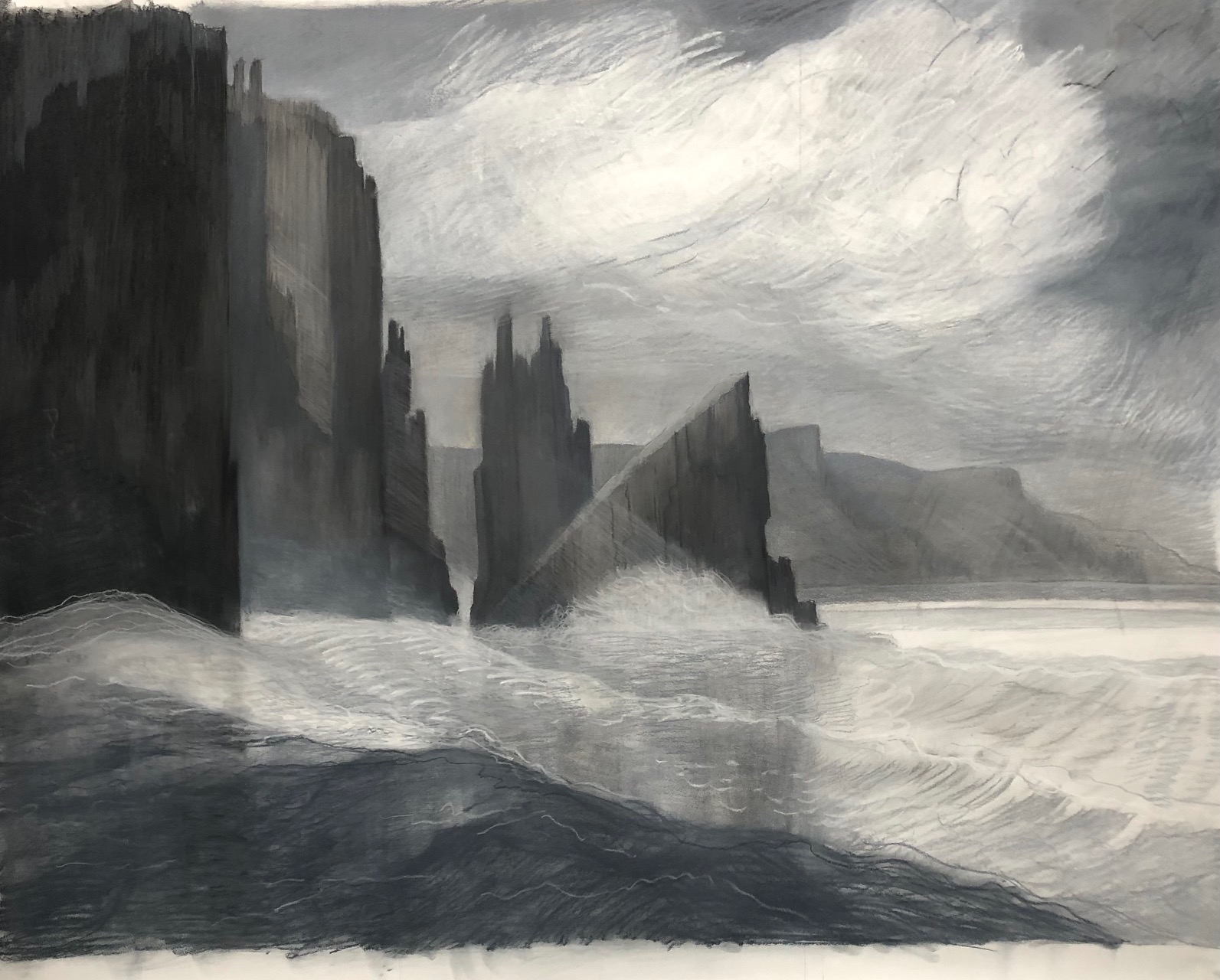 large white cloud sea cliffs